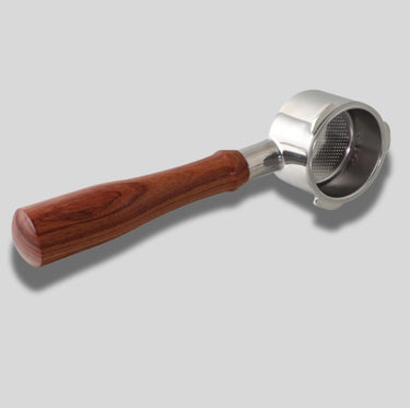 Coffee filter with wooden handle on a gray background